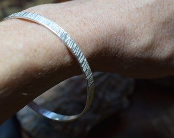 Hammered Silver Bangle, handmade from recycled silver, 5mm wide, hallmarked, handcrafted in the UK by All That Glitters