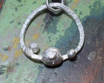 Round Textured Silver Pendant, with silver pebble design