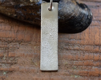 Unique Silver Pendant - handcrafted in silver with a rough, organic texture