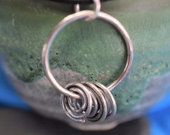 Oxidised, Textured Silver Spiral Pendant, with an organic, reticulated finish