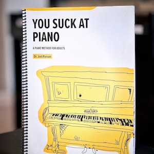 You Suck At Piano- 50 simple piano arrangements that teach the fundamentals of piano playing and music theory (in a humorous way).