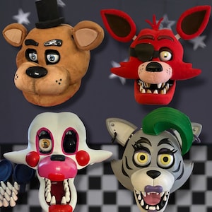 May include: Four plush animal masks, including a brown bear, a red fox with an eye patch, a white and pink rabbit, and a gray wolf with green hair. The masks are all detailed and realistic, with expressive eyes and mouths.