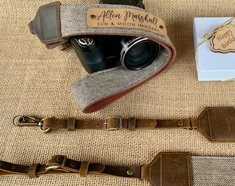 May include: A brown leather camera strap with a tweed pattern and a personalized leather tag that reads "Allen Marshall SUN & MOON IMAGERY".