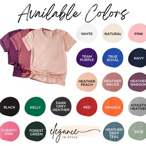 May include: Image showcasing a selection of t-shirts in various colors, including white, pink, and navy. The text "Available Colors" is displayed at the top, with additional color options like "Heather Peach" and "Kelly" presented in circular swatches. The phrase "Elegance in Style" is also visible.