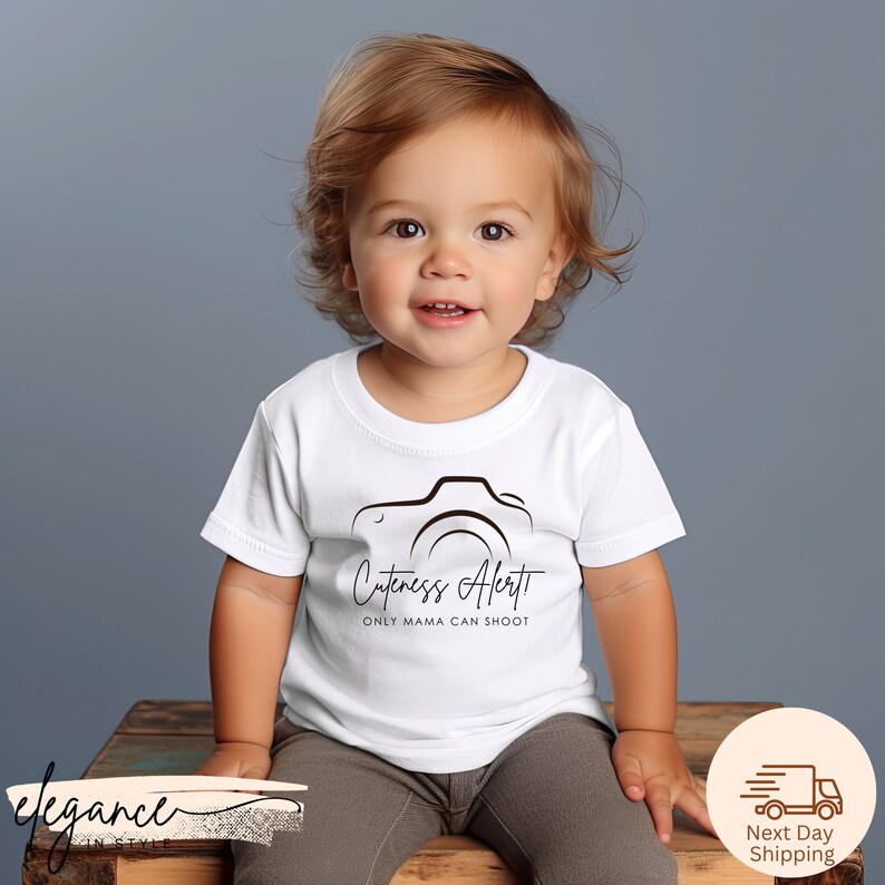 a little girl sitting on top of a wooden box