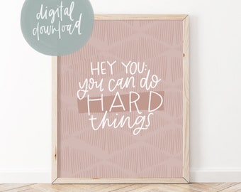 May include: A pink and white printable wall art print with the text "Hey you: you can do hard things".