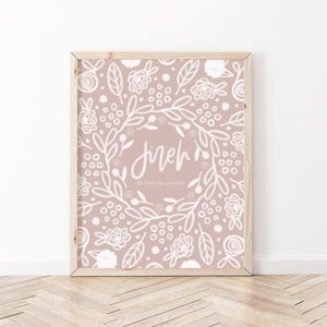 May include: A pink floral print with a white wreath and the word "Jireh" in the center. The text below the wreath reads "the God who provides".