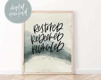 May include: A digital download print with a watercolor background in shades of blue and green. The words "restored, redeemed, reconciled" are written in black calligraphy.