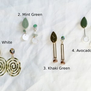 May include: Four pairs of earrings with different colored leaves and beads. The earrings are labeled 1. White, 2. Mint Green, 3. Khaki Green, and 4. Avocado Green.