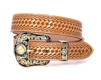 May include: A tan leather belt with a basketweave pattern. The belt features a decorative buckle with a horse head, stars, and floral accents in gold and black. The belt is a western-style accessory.