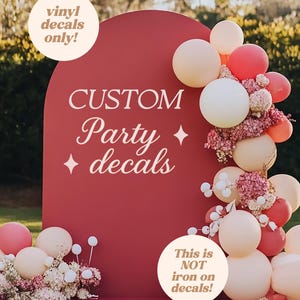 May include: A red arched backdrop featuring white text that reads CUSTOM Party decals with two star icons. The display is decorated with a cluster of cream, pink, and coral balloons along with pink floral accents. Text overlays state vinyl decals only and This is NOT iron on decals.
