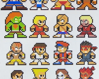 Op de afbeelding: Een set van 20 pixel art stickers met personages uit de Street Fighter-videogameserie. De stickers zijn gedrukt op wit papier en bevatten personages zoals Ryu, Chun-Li, Ken en Zangief.