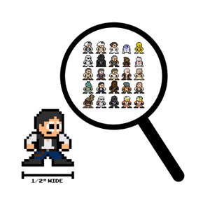 May include: A pixel art illustration of Han Solo from Star Wars. He is wearing a brown vest, blue trousers, and a blaster on his hip. The image is 1/2 inch wide. A magnifying glass shows a grid of pixel art characters from Star Wars.