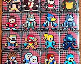 May include: A collection of sixteen square pin-back buttons featuring pixel art characters from video games. Each button displays a unique character against a dark grid background with a red circular emblem, showcasing various colourful figures.