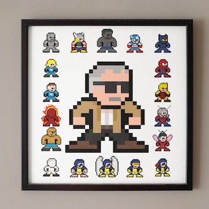 May include: A framed print featuring a pixel art illustration of a man with gray hair and sunglasses surrounded by various superhero characters, including Captain America, Thor, Hulk, Iron Man, Spider-Man, and more.