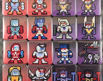 May include: A set of sixteen square coasters featuring pixel art illustrations of various robot characters. Each coaster displays a unique character in a grid-like pattern against a solid red or purple background with a subtle white grid overlay.