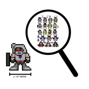 May include: Pixelated image of a gray robot character with red eyes and a purple emblem, approximately 1.3 cm wide. A magnifying glass shows a collection of pixelated robot characters in various colours. The background is white.