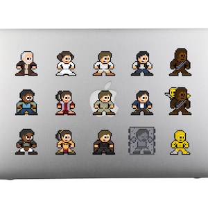May include: A set of 15 pixel art stickers featuring characters from Star Wars. The stickers are on a silver laptop. The characters include Luke Skywalker, Princess Leia, Han Solo, Chewbacca, Darth Vader, Yoda, R2-D2, C-3PO, and more.