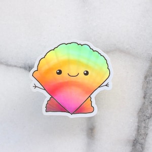 May include: A colorful rainbow-colored shell sticker with a smiling face. The shell is a light green, yellow, orange, pink, and red gradient.
