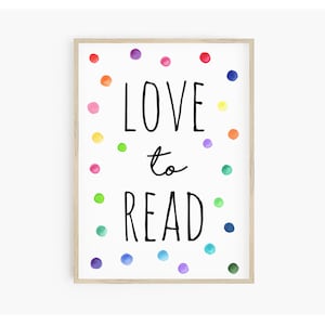 May include: A framed print with the text "LOVE to READ" in black lettering surrounded by colorful dots on a white background.