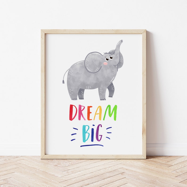May include: A framed print with a watercolor illustration of a gray elephant with its trunk raised. The text "DREAM BIG" is written in rainbow colors below the elephant.