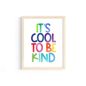 May include: A framed print with the text "It's Cool To Be Kind" in colorful, watercolor-style letters.