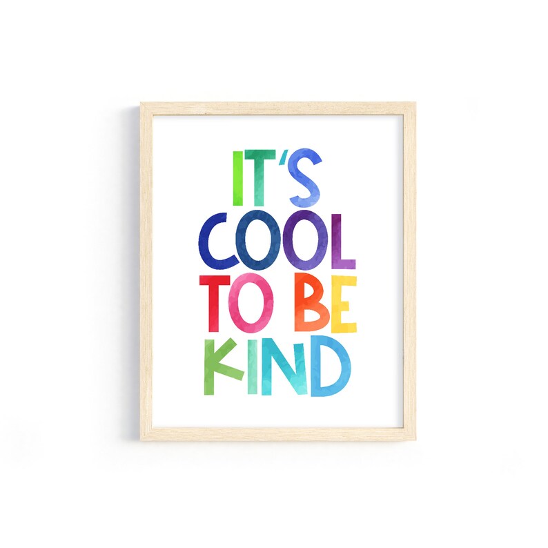 May include: A framed print with the text "It's Cool To Be Kind" in colorful, watercolor-style letters.