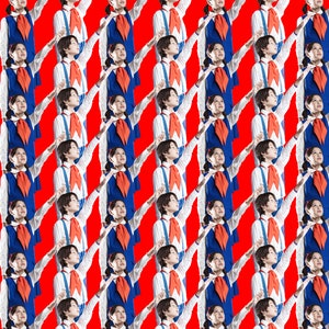 May include: A group of children wearing red and blue uniforms stand in rows, all raising their right arms in a salute. The children are standing on a red background.