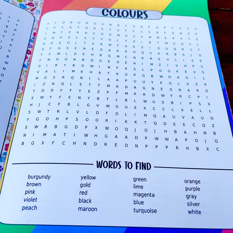 May include: A colorful word search puzzle with the word "COLOURS" at the top. The puzzle features a grid of letters with words related to colors to find, such as "burgundy", "yellow", "green", "lime", "orange", "purple", "pink", "red", "magenta", "gray", "violet", "black", "blue", "silver", "peach", and "maroon".