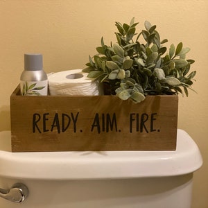 Ready. Aim. Fire. toilet paper holder. Toilet paper box. Toilet paper storage. Toilet box.