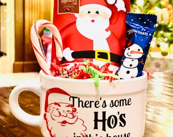 There’s some Hos in this house mug. Funny hot chocolate mug. Mug filled with hot chocolate mix, candy cane, chocolate marshmallow.