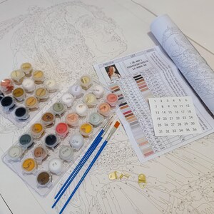 a white table topped with lots of crafting supplies