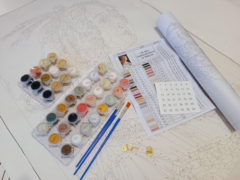 a white table topped with lots of crafting supplies
