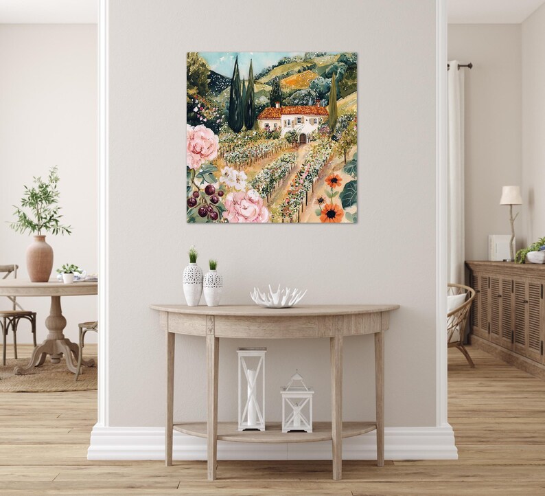 a living room with a large painting of a countryside landscape hanging on the wall above a wooden console table.