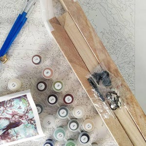a table topped with lots of crafting supplies