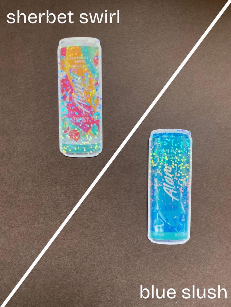 May include: Two aluminum cans with glitter designs. The can on the left is orange and pink with the text "Aloha" and "Sherbet Swirl". The can on the right is blue with the text "Aloha" and "Blue Slush".