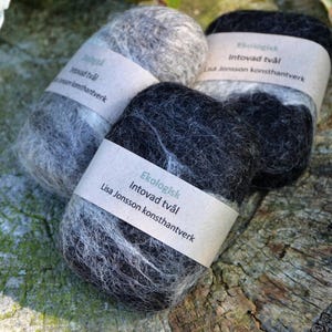 May include: Three handmade soap bars wrapped in felted wool. The soap bars are labelled "Ekologisk Intovad tv&aring;l Lisa Jonsson konsthantverk".