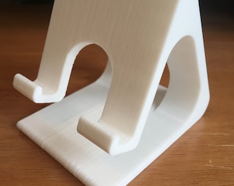 Universal Phone stand with charging wire port