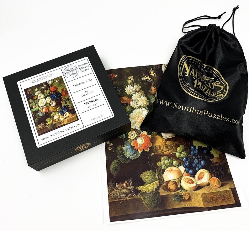 May include: A 172-piece jigsaw puzzle featuring a still life painting of flowers, fruit, and a bird's nest. The puzzle is made by Nautilus Puzzles and is 11 inches by 8 inches.