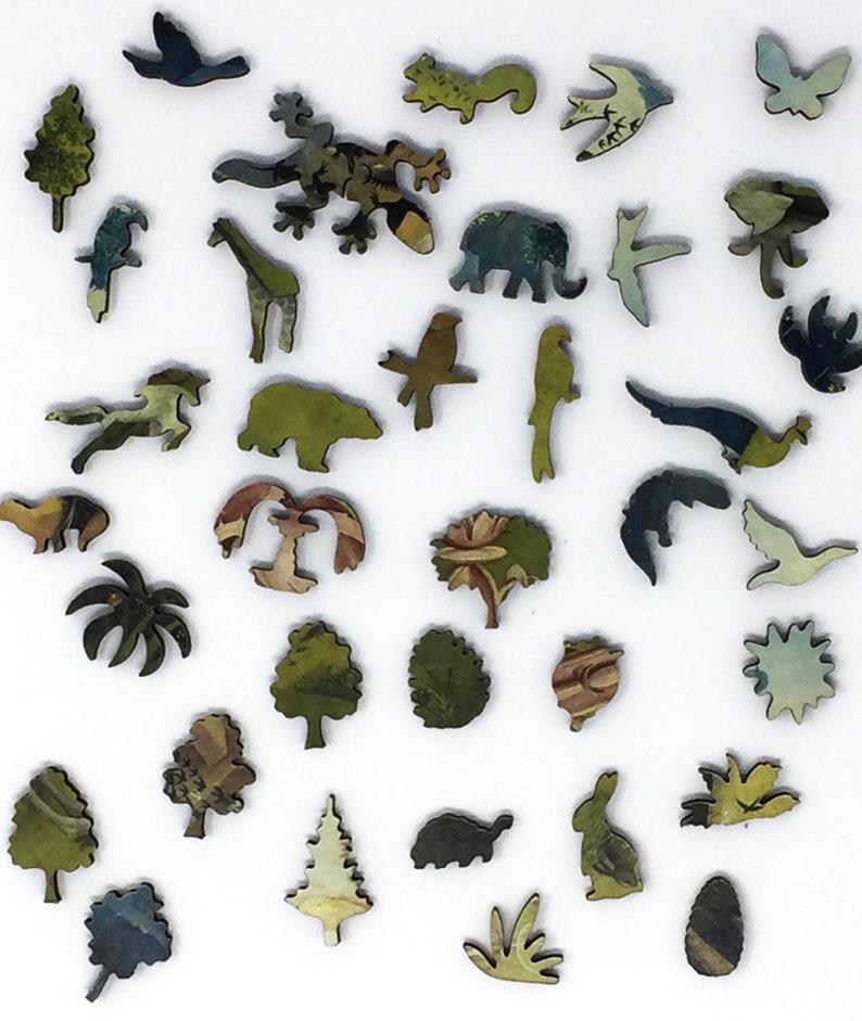 May include: A wooden jigsaw puzzle with a variety of animal and plant shapes. The pieces are painted in a variety of colors, including green, blue, and brown. The puzzle is made up of 30 pieces.