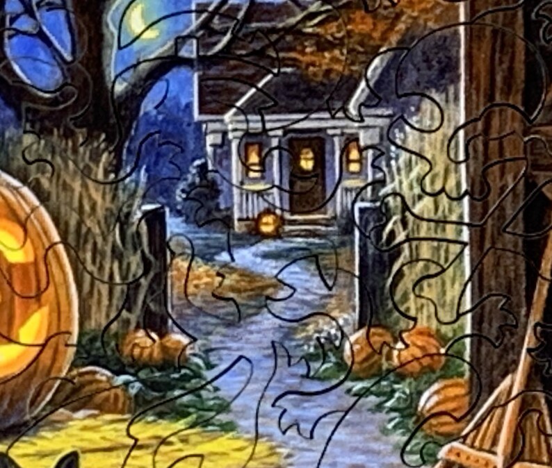 May include: A Halloween scene featuring a carved pumpkin, a house with illuminated windows, and a path leading towards the house. The scene is set at night with a crescent moon in the sky.