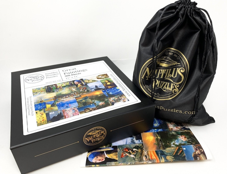 May include: A black box set of a 366-piece wooden jigsaw puzzle featuring famous paintings. The box is labeled "Great Paintings" and measures 15" x 11". A black drawstring bag with a gold logo and a partial image of the puzzle are also included.