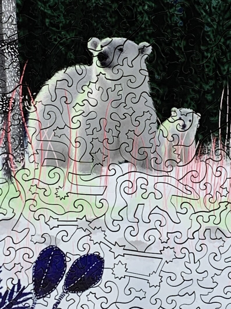 May include: A white polar bear and her cub stand in a snowy forest. The bear is looking to the right, while the cub is looking at the viewer. The background is a dark green forest with white snow on the ground.