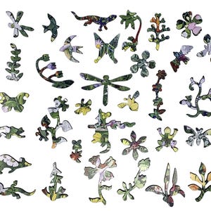 May include: A collection of wooden puzzle pieces in various shapes, including flowers, insects, and leaves. The pieces are decorated with a floral and nature-themed pattern in shades of green, white, and yellow, creating a whimsical and engaging design.