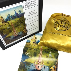 May include: A 400-piece wooden jigsaw puzzle of Hieronymus Bosch's 'The Garden of Earthly Delights' in a black box with a gold satin bag. The box has the title of the puzzle and the artist's name on it. The bag has the Nautilus Puzzles logo and website address.