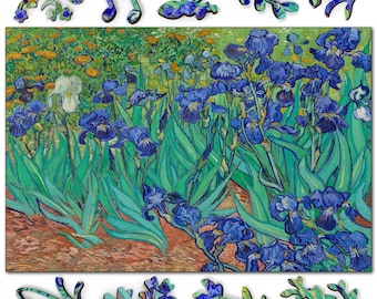 May include: A wooden jigsaw puzzle featuring a reproduction of Vincent van Gogh's Irises painting, with vibrant blue flowers, green foliage, and a single white iris, accompanied by several uniquely shaped individual puzzle pieces.