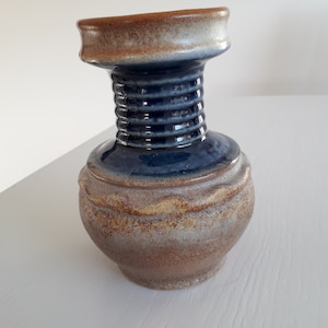 Ceramic vase in glaze in beige and blue. German vintage 1970s.