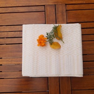 Handwoven white and yellowish linen tablecloth. Swedish vintage 1960s.