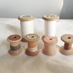 Six vintage wooden spools bobbins. Home decor. Sweden 1950s.