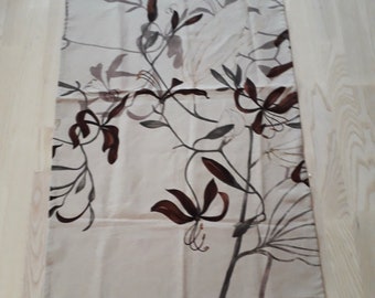 Swedish table runner with a printed floral motive.